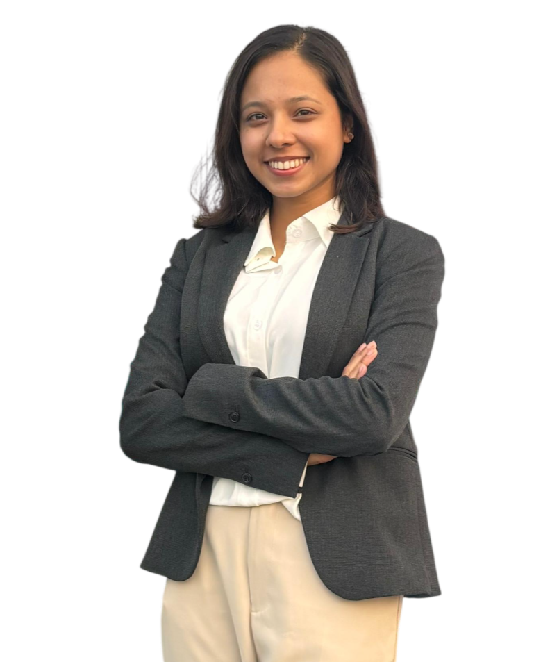Shreen Subedi smiling with arms crossed, wearing a dark blazer and white shirt